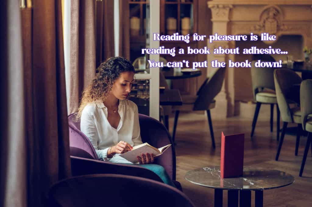 woman is reading in a restaurant and text says "reading for pleasure is like reading a book about adhesive... you can't put the book down!" 