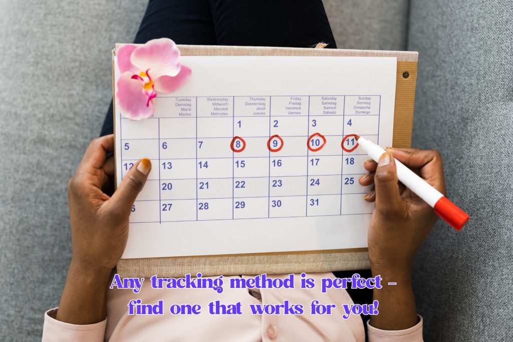 paper calendar is on a lap with a pair of hands circling dates. text below reads "Any tracking method is perfect - 
find one that works for you! "