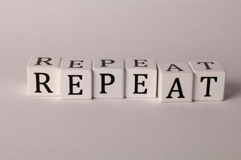 blocks that spell "repeat" are on a plain background 