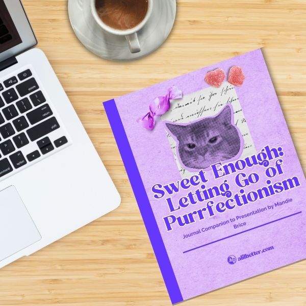 shows journal cover next to laptop and cup of espresso. journal has cat on it and says "Sweet enough: letting go of purrfectionism" journal companion to presentation by Mandie Brice - to fight perfectionism 